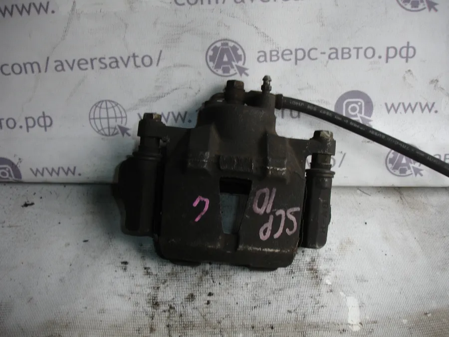 Суппорт Передний левый Toyota Vitz SCP10