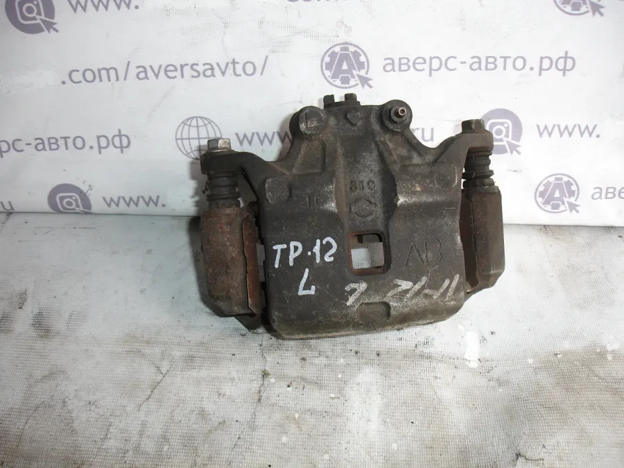 Суппорт левый передний Nissan Primera TP12